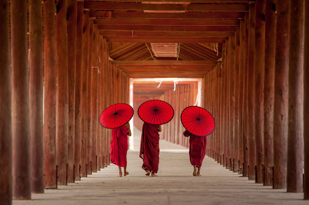 EARS - Buddhists with umbrellas