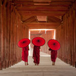 EARS - Buddhists with umbrellas